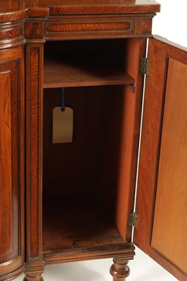 Lot 969 - A GEORGE III SHERATON STYLE FIDDLE-BACK MAHOGANY BREAKFRONT BOOKCASE OF SMALL SIZE AND PROPORTIONS