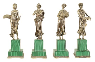 Lot 319 - A SET OF FOUR ITALIAN SILVER AND MALACHITE SCULPTURES