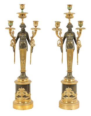 Lot 582 - A PAIR OF LATE 19TH CENTURY BRONZE AND ORMOLU FRENCH EMPIRE STYLE THREE BRANCH  FIGURAL CANDELABRA