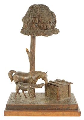 Lot 557 - A FINE 20TH CENTURY CARVED WALNUT BLACK FOREST EQUESTRIAN DESK LAMP