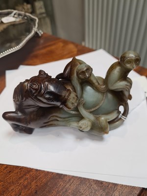 Lot 200 - AN EARLY CHINESE CARVED RUSSET JADE SCULPTURE OF A RECUMBENT HORSE AND THREE MONKEYS
