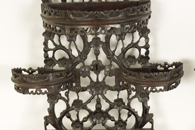 Lot 164 - A PAIR OF 19TH CENTURY CHINESE CARVED HARDWOOD HANGING SHELVES