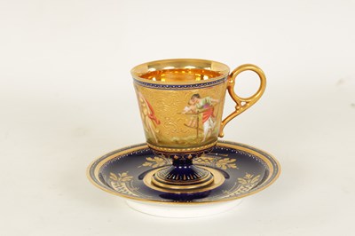 Lot 24 - A FINE LATE 19TH CENTURY VIENNA STYLE RICHLY GILT AND ROYAL BLUE CABINET CUP AND SAUCER