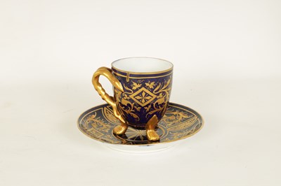 Lot 28 - A LATE 19TH CENTURY VIENNA STYLE RICHLY GILT AND ROYAL BLUE CABINET CUP AND SAUCER