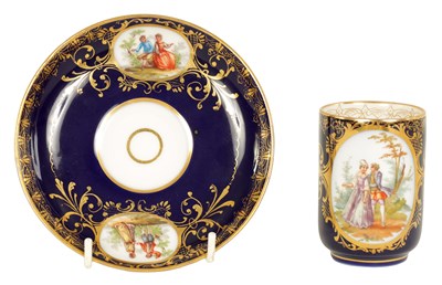 Lot 18 - A LATE 19TH CENTURY VIENNA STYLE SCROLLED GILT AND ROYAL BLUE CABINET CUP AND SAUCER