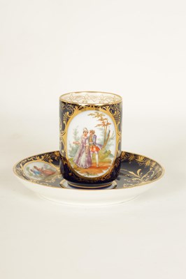 Lot 18 - A LATE 19TH CENTURY VIENNA STYLE SCROLLED GILT AND ROYAL BLUE CABINET CUP AND SAUCER