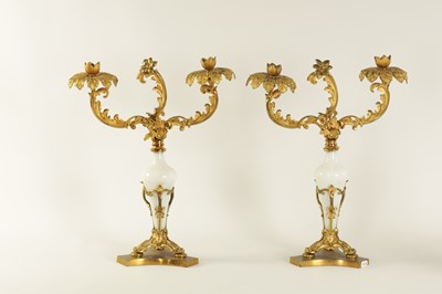 Lot 716 - A PAIR OF 19TH CENTURY TWO BRANCH ORMOLU AND OPAQUE GLASS CANDELABRA