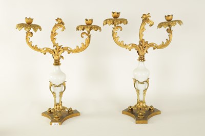 Lot 716 - A PAIR OF 19TH CENTURY TWO BRANCH ORMOLU AND OPAQUE GLASS CANDELABRA