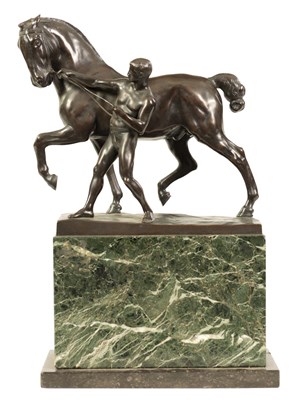 Lot 569 - RUDOLPH KAESBACH (1873 - 1950) AN EARLY 20TH CENTURY PATINATED BRONZE SCULPTURE OF A MAN AND HORSE