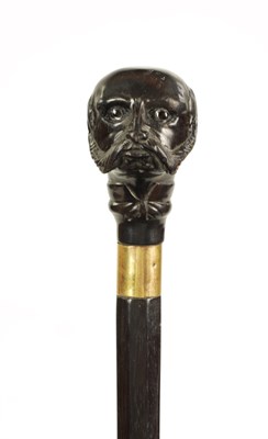 Lot 352 - A LATE 19TH CENTURY CARVED EBONY WALKING STICK