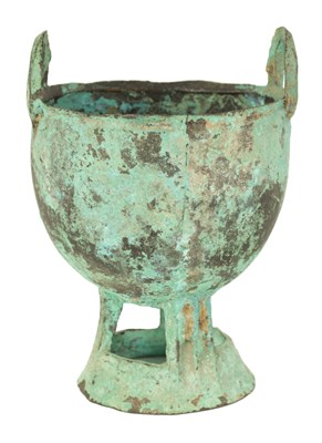 Lot 515 - AN ANCIENT PATINATED BRONZE TWO HANDLED VESSEL - POSSIBLY ROMAN