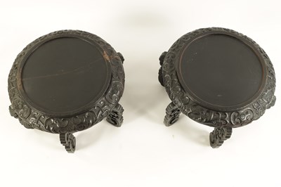 Lot 118 - A PAIR OF 19TH CENTURY CHINESE CARVED EBONISED HARDWOOD VASE STANDS