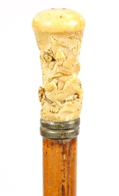 Lot 356 - A 19TH CENTURY CARVED IVORY AND MALACCA WALKING STICK