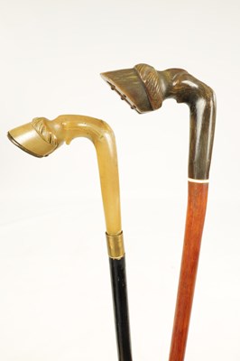 Lot 345 - TWO 19TH CENTURY CARVED HORN HANDLED WALKING STICKS