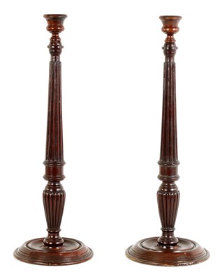 Lot 923 - A PAIR OF 19TH CENTURY MAHOGANY WEIGHTED BASE CANDLESTICKS