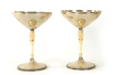 Lot 292 - A PAIR OF EARLY 20TH CENTURY SILVER AND CARVED IVORY CHALICES BY M.T. WETZLAR