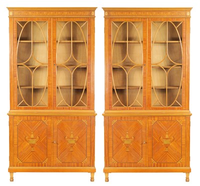 Lot 887 - MAPLE & CO. A PAIR OF EDWARDIAN FIGURED SATINWOOD AND MARQUETRY INLAID GLAZED BOOKCASES