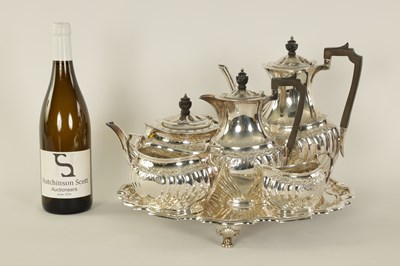 Lot 331 - AN EDWARD VII FIVE PIECE SILVER TEA SERVICE TOGETHER WITH A SILVER PLATED SALVER