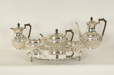 Lot 331 - AN EDWARD VII FIVE PIECE SILVER TEA SERVICE TOGETHER WITH A SILVER PLATED SALVER