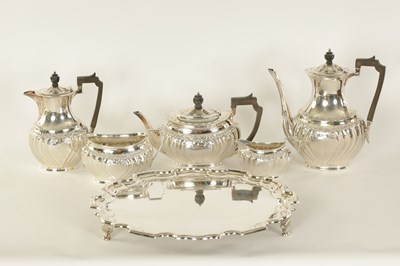 Lot 331 - AN EDWARD VII FIVE PIECE SILVER TEA SERVICE TOGETHER WITH A SILVER PLATED SALVER