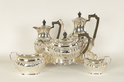 Lot 331 - AN EDWARD VII FIVE PIECE SILVER TEA SERVICE TOGETHER WITH A SILVER PLATED SALVER