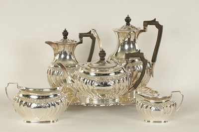 Lot 331 - AN EDWARD VII FIVE PIECE SILVER TEA SERVICE TOGETHER WITH A SILVER PLATED SALVER