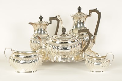 Lot 331 - AN EDWARD VII FIVE PIECE SILVER TEA SERVICE TOGETHER WITH A SILVER PLATED SALVER