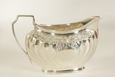 Lot 331 - AN EDWARD VII FIVE PIECE SILVER TEA SERVICE TOGETHER WITH A SILVER PLATED SALVER