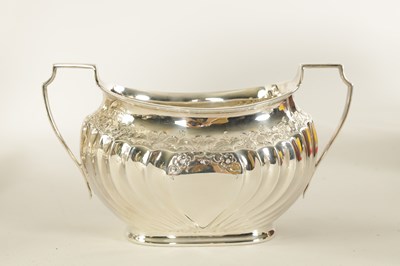 Lot 331 - AN EDWARD VII FIVE PIECE SILVER TEA SERVICE TOGETHER WITH A SILVER PLATED SALVER