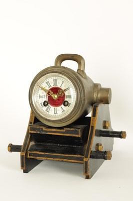 Lot 797 - A LATE 19TH CENTURY FRENCH INDUSTRIAL SILVERED BRASS DESK CLOCK FORMED AS A CANNON