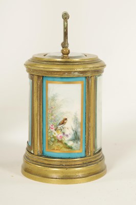 Lot 690 - A LATE 19TH CENTURY FRENCH OVAL MINIATURE PORCELAIN PANELLED CARRIAGE CLOCK