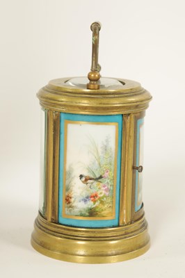 Lot 690 - A LATE 19TH CENTURY FRENCH OVAL MINIATURE PORCELAIN PANELLED CARRIAGE CLOCK
