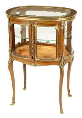 Lot 981 - A 19TH CENTURY FRENCH STAINED FRUITWOOD AND ORMOLU MOUNTED OVAL FREE-STANDING GLAZED DISPLAY TABLE