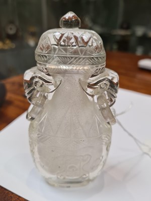 Lot 102 - A CHINESE CARVED ROCK CRYSTAL SNUFF BOTTLE AND COVER