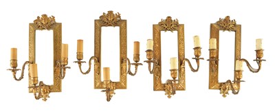 Lot 1094 - A SET OF FOUR 19TH CENTURY MIRRORED CAST GILT BRASS HANGING ELECTRIFIED THREE BRANCH WALL LIGHTS