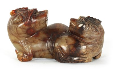 Lot 168 - A CHINESE CARVED RUSSET JADE SCULPTURE
