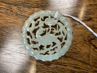 Lot 89 - A CHINESE CARVED JADE BROOCH