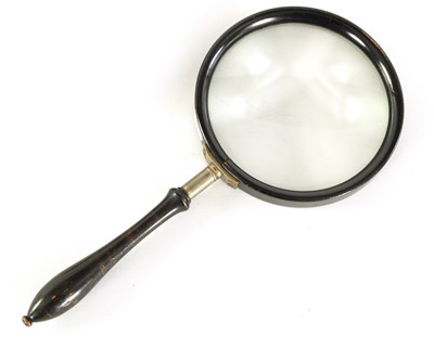 Lot 610 - A LATE 19TH CENTURY EBONISED 6" LIBRARY MAGNIFYING GLASS