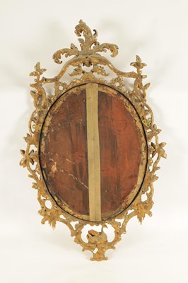 Lot 996 - A FINE MID 18TH CENTURY OVAL CARVED GILT GESSO HANGING MIRROR IN THE MANNER OF THOMAS CHIPPENDALE