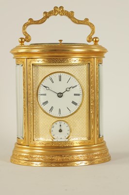 Lot 696 - A LATE 19TH CENTURY OVAL ENGRAVED GILT BRASS REPEATING CARRIAGE CLOCK
