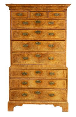 Lot 904 - A GEORGE I FIGURED WALNUT CHEST ON CHEST