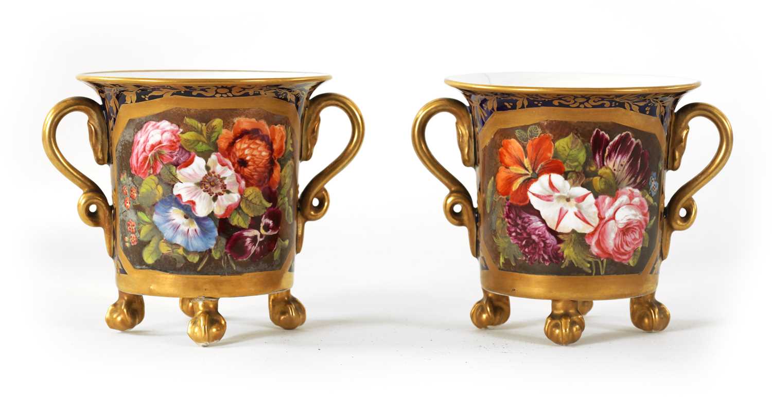 Lot 36 - A PAIR OF EARLY 19TH CENTURY DUESBURY DERBY TWO-HANDLED CUPS RAISED ON CLAW AND  BALL  FEET
