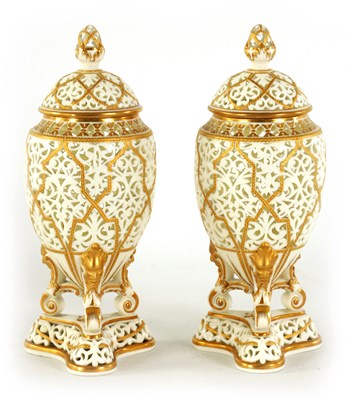 Lot 51 - A PAIR OF WORCESTER TYPE OVOID POT-POURRI VASES AND COVERS ON TRIFORM BASES - POSSIBLY GRAINGERS
