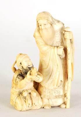 Lot 129 - AN EARLY 19TH CENTURY CARVED IVORY FIGURE GROUP