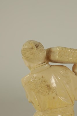 Lot 147 - A JAPANESE MEIJI PERIOD CARVED IVORY FIGURE