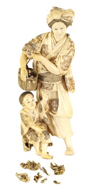 Lot 194 - A LARGE JAPANESE MEIJI PERIOD CARVED IVORY FIGURE GROUP