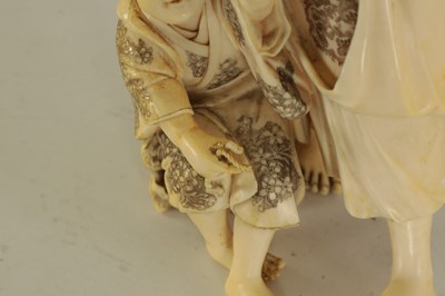 Lot 194 - A LARGE JAPANESE MEIJI PERIOD CARVED IVORY FIGURE GROUP