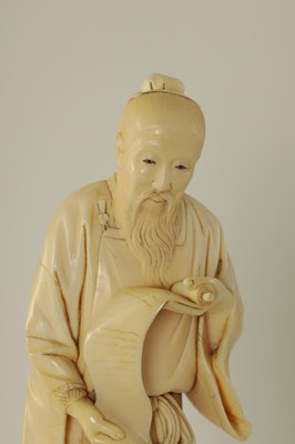 Lot 156 - A 19TH CENTURY CHINESE CARVED IVORY FIGURE