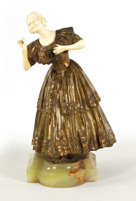 Lot 595 - PAUL PHILIPPE (1870 - 1930)  AN ART DECO PATINATED BRONZE AND IVORY FIGURE OF A YOUNG LADY