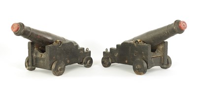 Lot 376 - A PAIR OF 19TH CENTURY CARVED WOOD CANNON MODELS